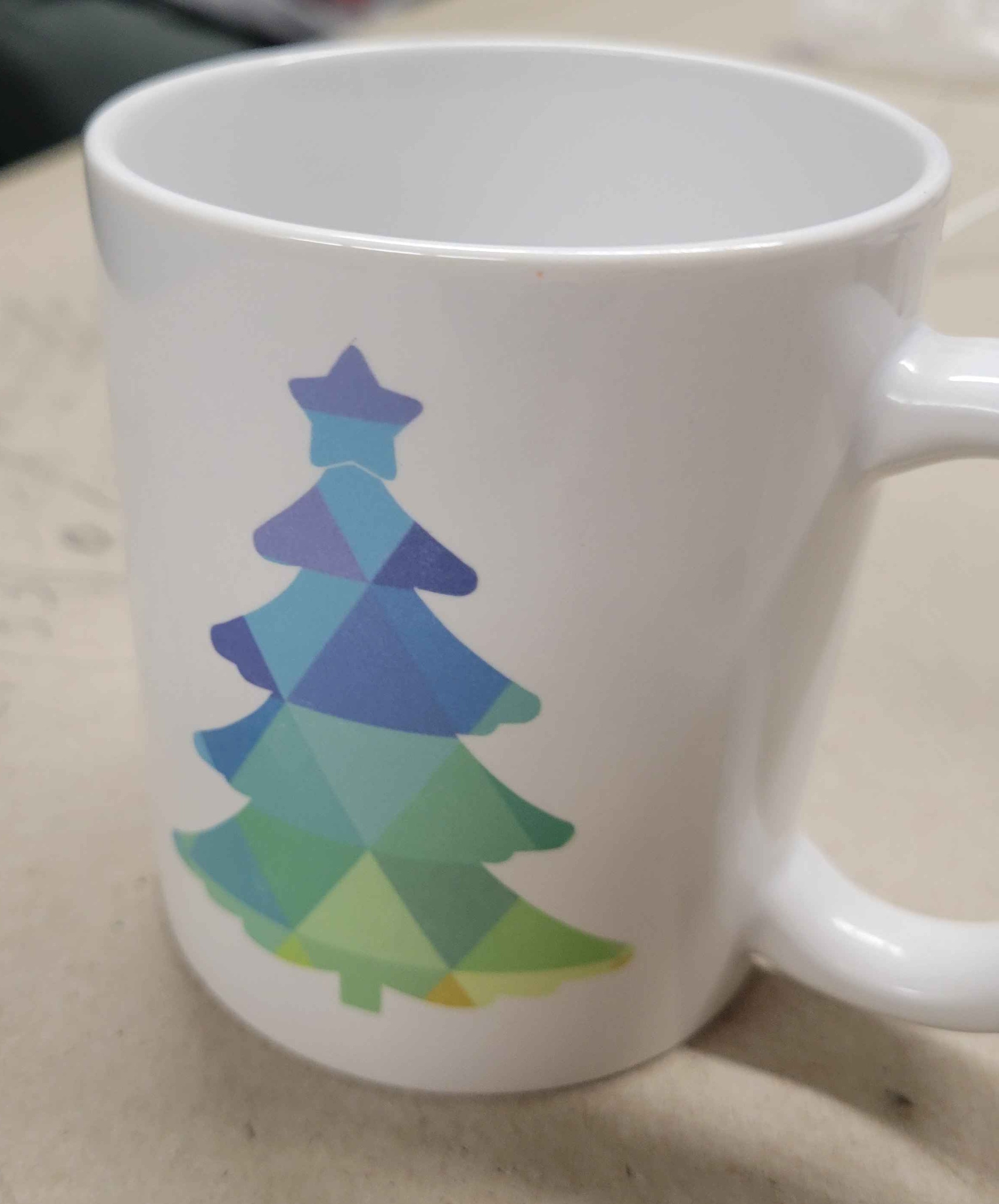 A holiday mug made using the Cricuit vinyl cutter
