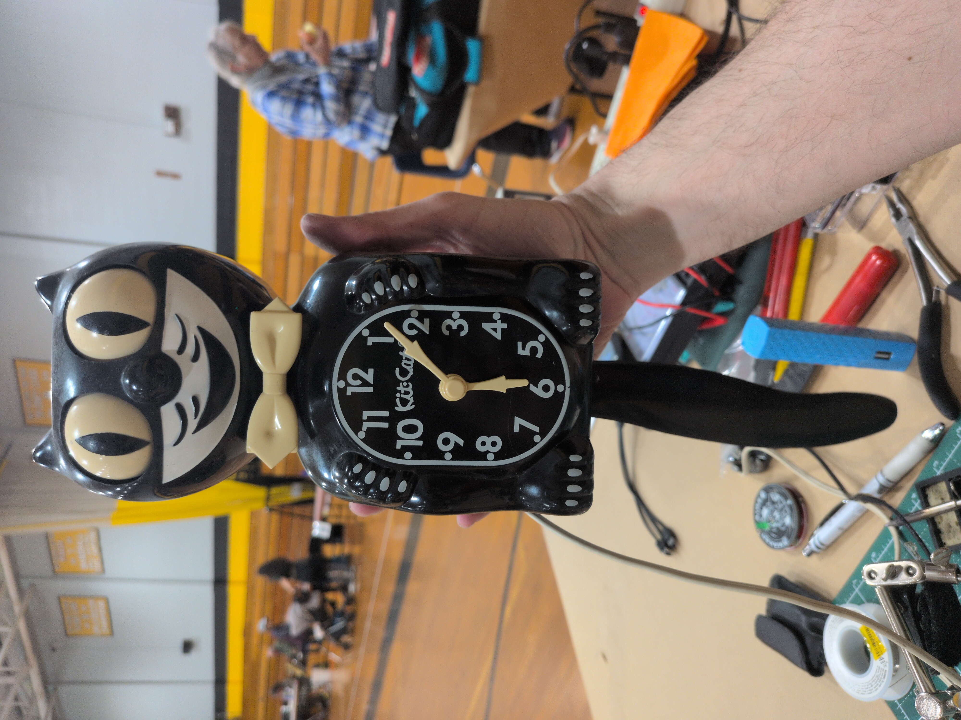 a vintage clock in the shape of a cat. When running, the eyes look back and forth as the tail swings for the pendulum 