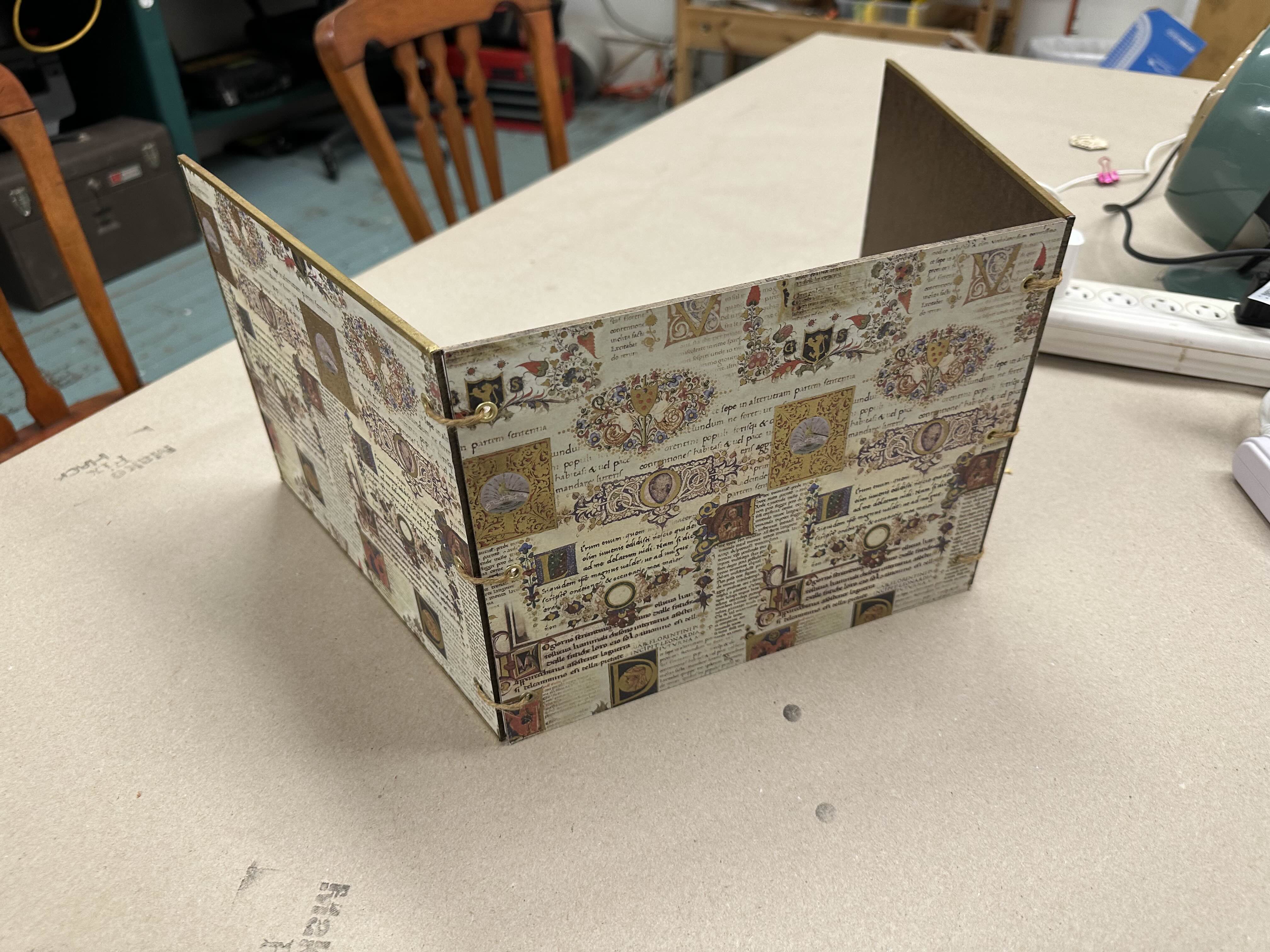 A DM screen for Dungeons and Dragons made by Tom using a variety of techniques